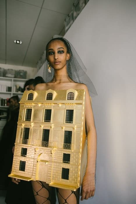 Dior just sent a wearable gold doll’s house down the runway